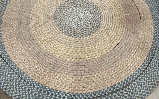 Can professional cleaning restore an old braided rug?