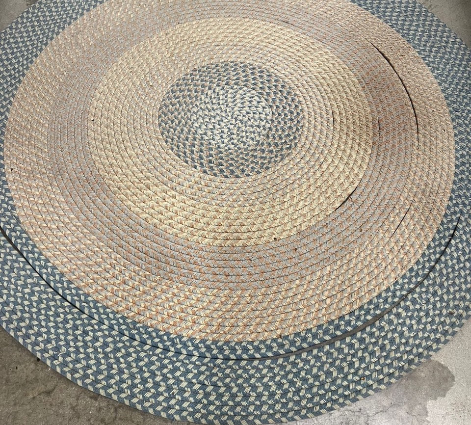 Can professional cleaning restore an old braided rug?