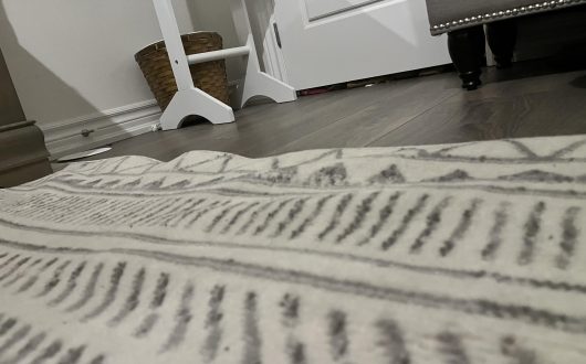 Why Rugs Develop Ripples and Buckling