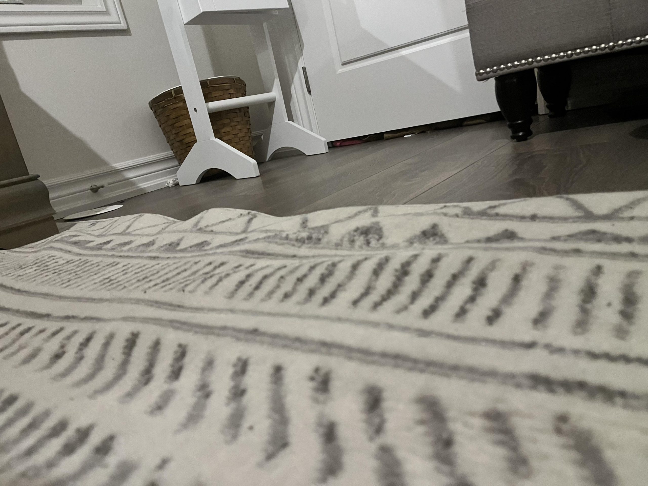 Why Rugs Develop Ripples and Buckling